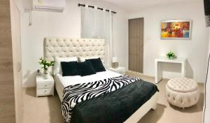 Ein Bett oder Betten in einem Zimmer der Unterkunft Hotel Platinum Barranquilla