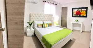 Ein Bett oder Betten in einem Zimmer der Unterkunft Hotel Platinum Barranquilla