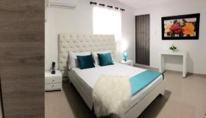 Ein Bett oder Betten in einem Zimmer der Unterkunft Hotel Platinum Barranquilla