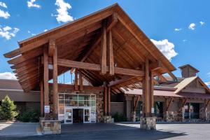 a timber frame building with a large wooden structure at The Grand Hotel, Ascend Hotel Collection in Frisco