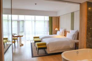Katil atau katil-katil dalam bilik di Pullman Changbaishan Resort