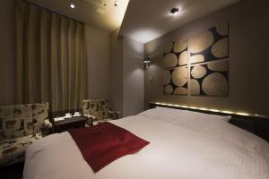 Postel nebo postele na pokoji v ubytování The CALM Hotel Tokyo