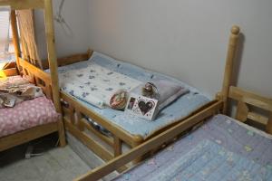 Кровать или кровати в номере DASAN HOUSE