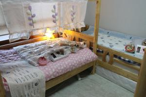 Een bed of bedden in een kamer bij DASAN HOUSE