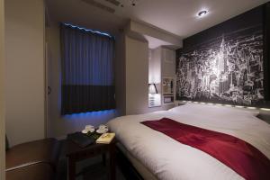 Postel nebo postele na pokoji v ubytování The CALM Hotel Tokyo