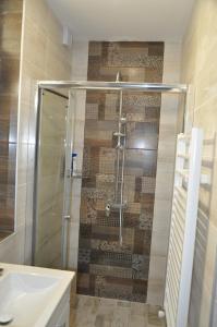 a bathroom with a shower and a sink at Къща за гости Ирис in Kyustendil +25 photos