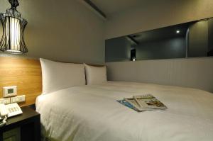Letto o letti in una camera di Forward Suites II