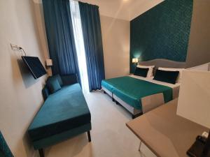 Postel nebo postele na pokoji v ubytování Hotel Maxim Axial