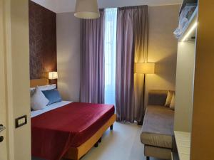 Postel nebo postele na pokoji v ubytování Hotel Maxim Axial