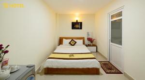 Postel nebo postele na pokoji v ubytování An Phu Hotel Da Lat