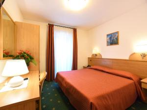 Voodi või voodid majutusasutuse Hotel Adriana toas