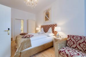 Llit o llits en una habitació de Boutique Hotel Goldenes Lamm Villach