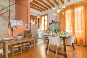 a kitchen with a table and chairs in a room at Miraclet - ADULTS ONLY in Palma de Mallorca