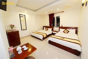 Postel nebo postele na pokoji v ubytování An Phu Hotel Da Lat