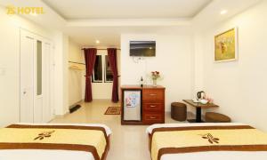 Postel nebo postele na pokoji v ubytování An Phu Hotel Da Lat