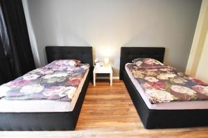 Ein Bett oder Betten in einem Zimmer der Unterkunft Dorya am Ring