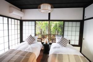 Katil atau katil-katil dalam bilik di Yamaguchi House Annex, Private House with Onsen