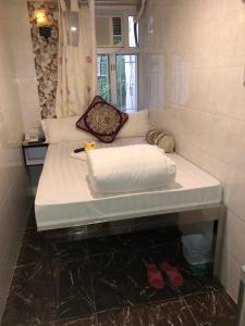 Ett badrum på Maharaja Guesthouse