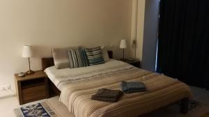 Postel nebo postele na pokoji v ubytování House Radu & Nata of Westeros