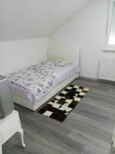 Voodi või voodid majutusasutuse Apartman All seasons toas