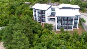 an aerial view of a building in the trees at Holiday Resort Ad Turres in Crikvenica