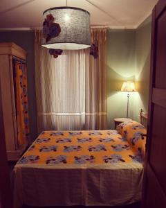 a bedroom with a bed with a teddy bear on it at Le Stanze del Borgo in Nettuno