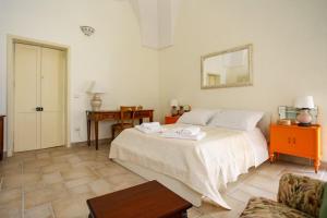 Ліжко або ліжка в номері Palazzo Candido Suites & Apartments - SIT Apartment