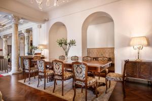 a dining room with a table and chairs at Hotel Bellevue - Liburnia in Opatija