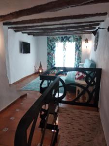 a bedroom with a bed and a table in a room at La Vía Verde in Jérica