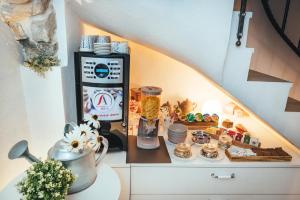 a table with food and a blender on a counter at Guesthouse Centrum B&B in Izola