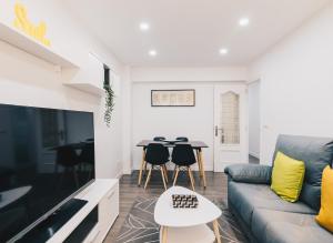 a living room with a couch and a table at Aiara apartment by People Rentals in Bilbao