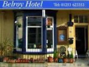 a building with a blue sign on the front of it at Belroy Hotel in Blackpool
