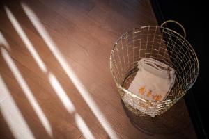 a wicker basket sitting on top of a wooden table at Moon and Chalice Boutique Hotel in Kunming