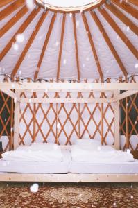 a mattress bed in a yurt tent at The Yurts at Margo's Garden, Kiroro in Akaigawa