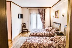 Ein Bett oder Betten in einem Zimmer der Unterkunft Κτήμα Γιαννιώτη Giannioti Estate