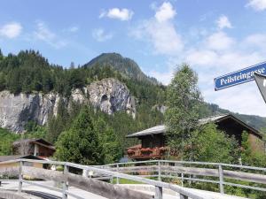 a street sign in front of a mountain at Haus Maria in Kleinarl +13 photos