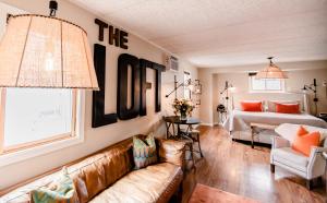 a living room with a couch and a bed at The Loft in Granville