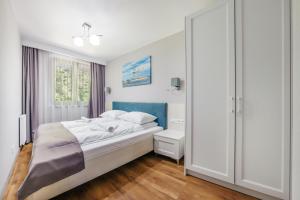 Posteľ alebo postele v izbe v ubytovaní Apartamenty Cypel Helski