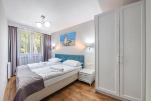 Posteľ alebo postele v izbe v ubytovaní Apartamenty Cypel Helski