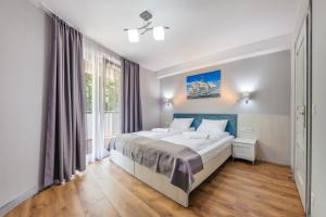 Posteľ alebo postele v izbe v ubytovaní Apartamenty Cypel Helski