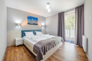 Posteľ alebo postele v izbe v ubytovaní Apartamenty Cypel Helski