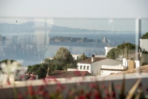 a city with a view of the water and buildings at Alta House Begur in Begur