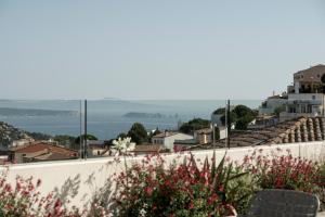 a view from the roof of a building with flowers at Alta House Begur in Begur