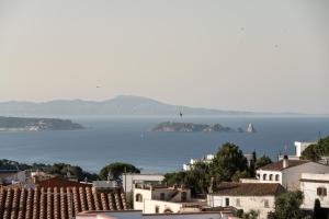 a view of the ocean from a city at Alta House Begur in Begur