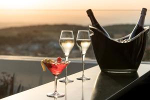 three glasses of wine and a bottle of champagne at Alta House Begur in Begur