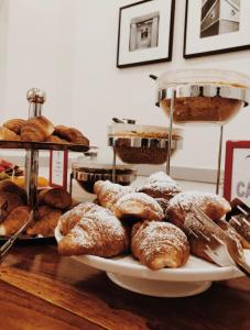 a plate of pastries and other pastries on a table at Europa Hotel in Sliema