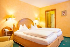 Postel nebo postele na pokoji v ubytování Hotel Wilder Mann