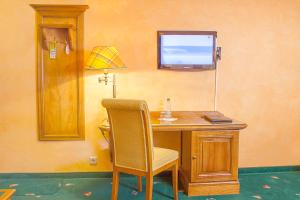 TV a/nebo společenská místnost v ubytování Hotel Wilder Mann