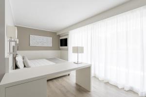 Postel nebo postele na pokoji v ubytování Hotel Vittoria