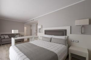 Postel nebo postele na pokoji v ubytování Hotel Vittoria